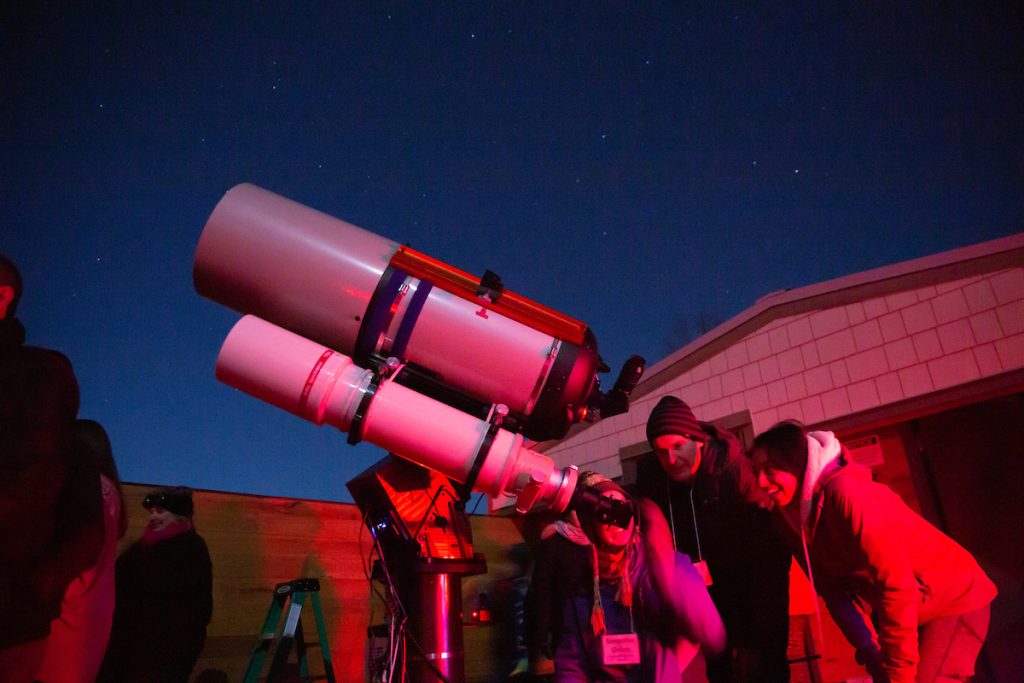 UNC Asheville students using a telescope at the Lookout Observatory