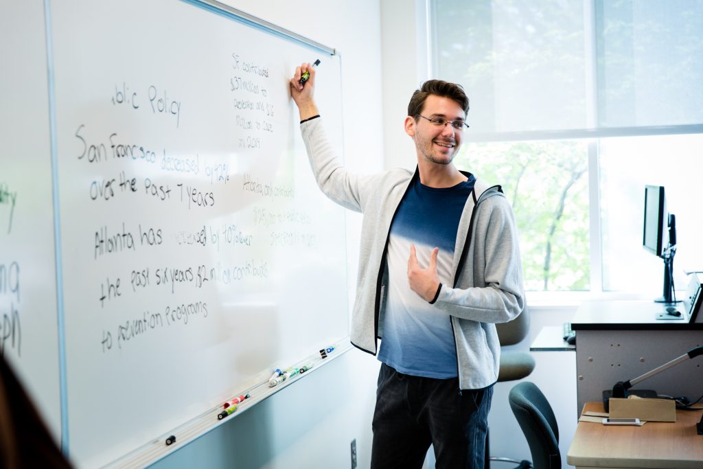 Person giving a classroom presentation