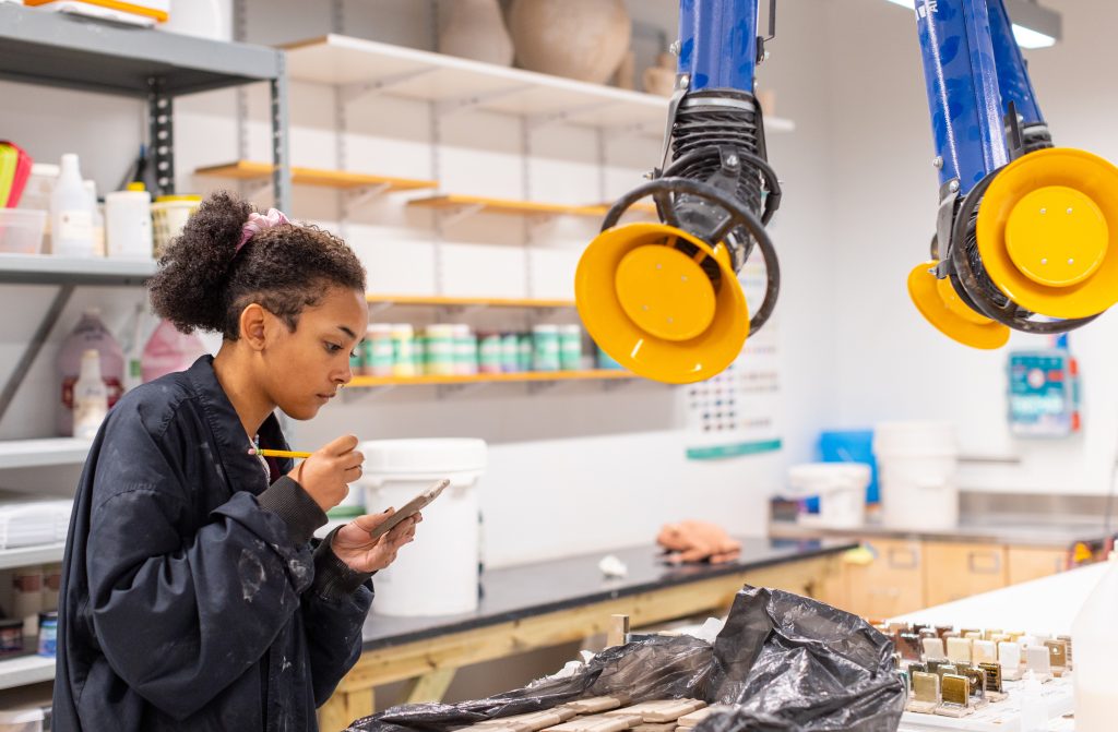 A ceramics student at work