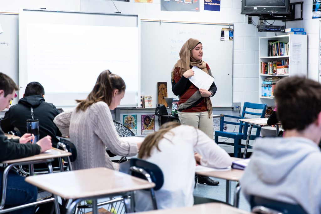 A student speaking to a class