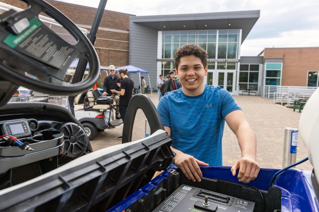 Trevor Goldston at the EV car show